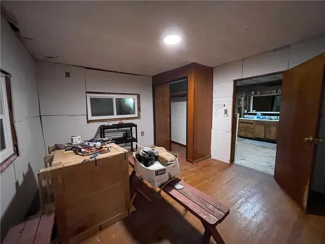 a room with furniture pool table and flat screen tv