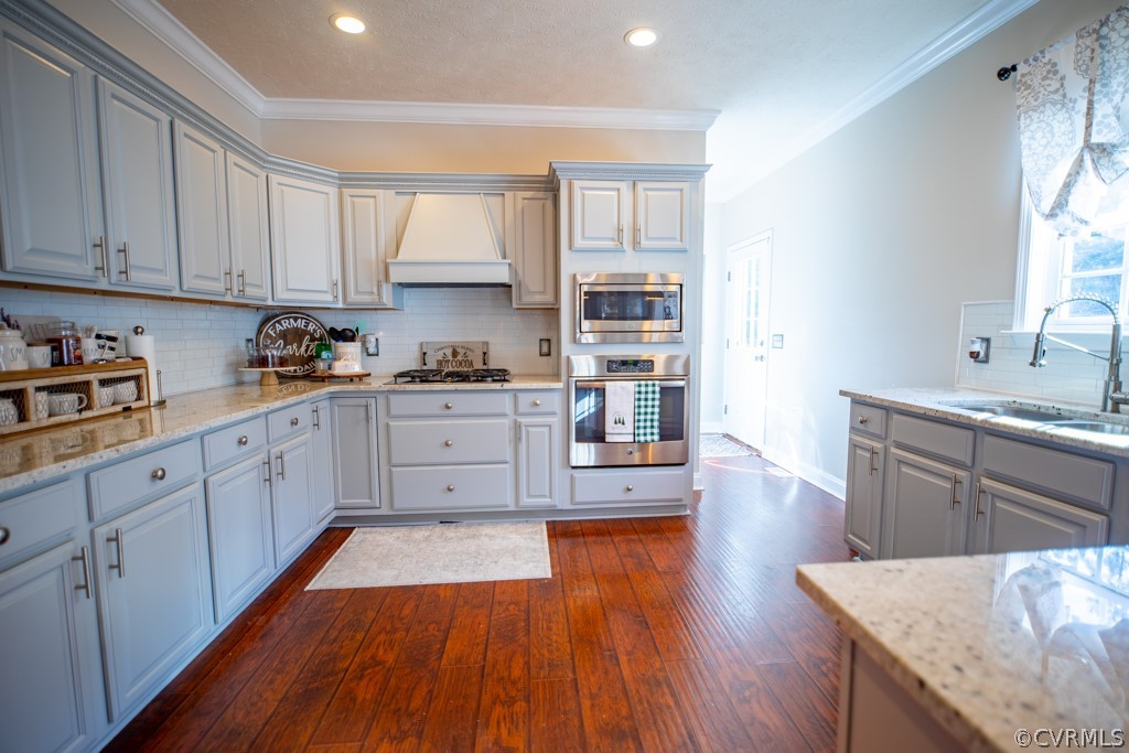 209 Chapel Road Kenbridge, VA 23944 - Photo 20 of 31 a large kitchen with wooden floors and white cabinets