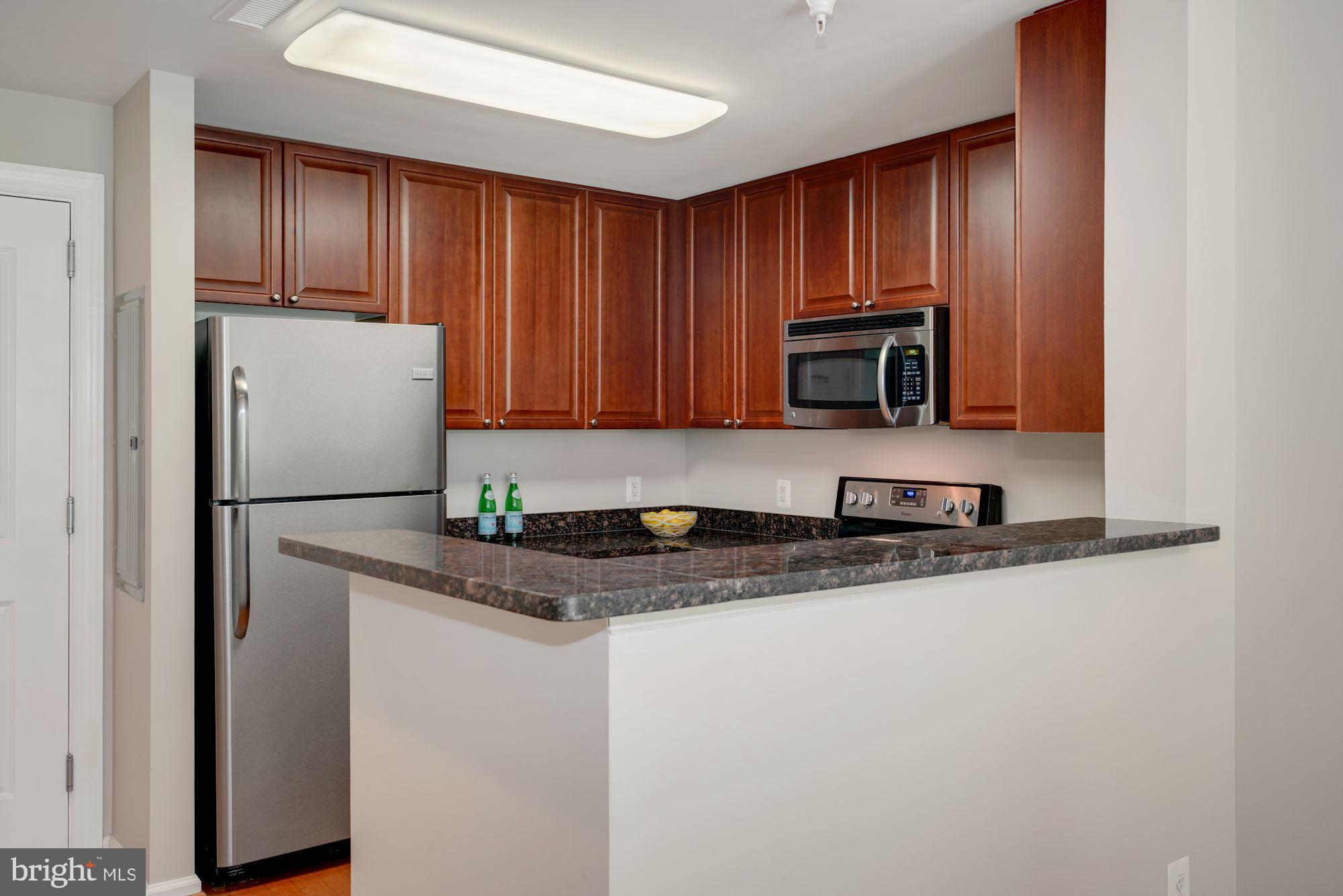 11700 Old Georgetown Road, Unit 406 North Bethesda, MD 20852 - Photo 9 of 29 Another kitchen perspective