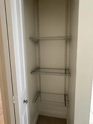 an aerial view of a house with a yard and a garage