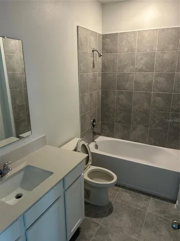 a bathroom with a sink a toilet and a bathtub