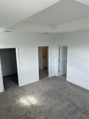 a view of an empty room and closet