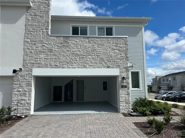 a front view of a house with a garage