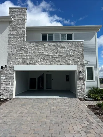 a front view of a house with a large space