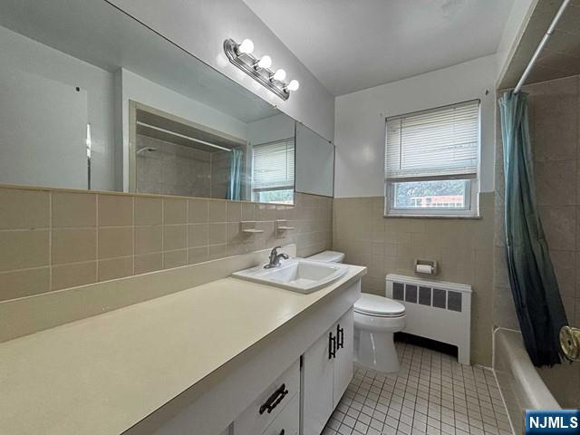 2004 Hoefleys Lane Fort Lee, NJ 07024 - Photo 9 of 9 a bathroom with a double vanity sink a toilet a mirror and shower