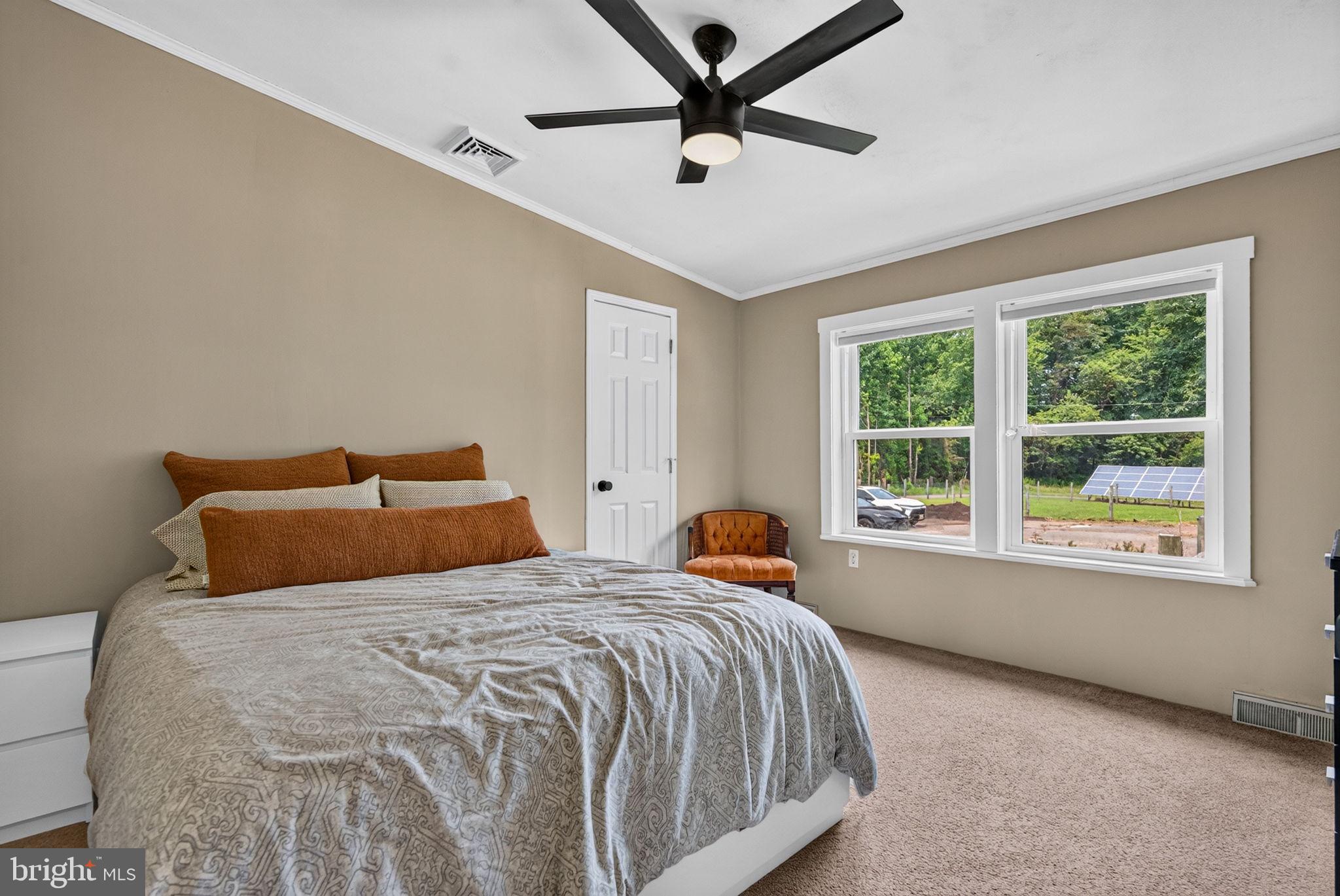 106 Quinton Alloway Road Salem, NJ 08079 - Photo 33 of 63 a large bed sitting in a bedroom next to a window