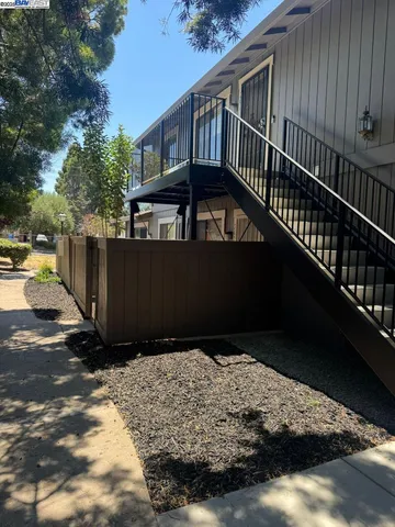 a view of balcony with wooden floor