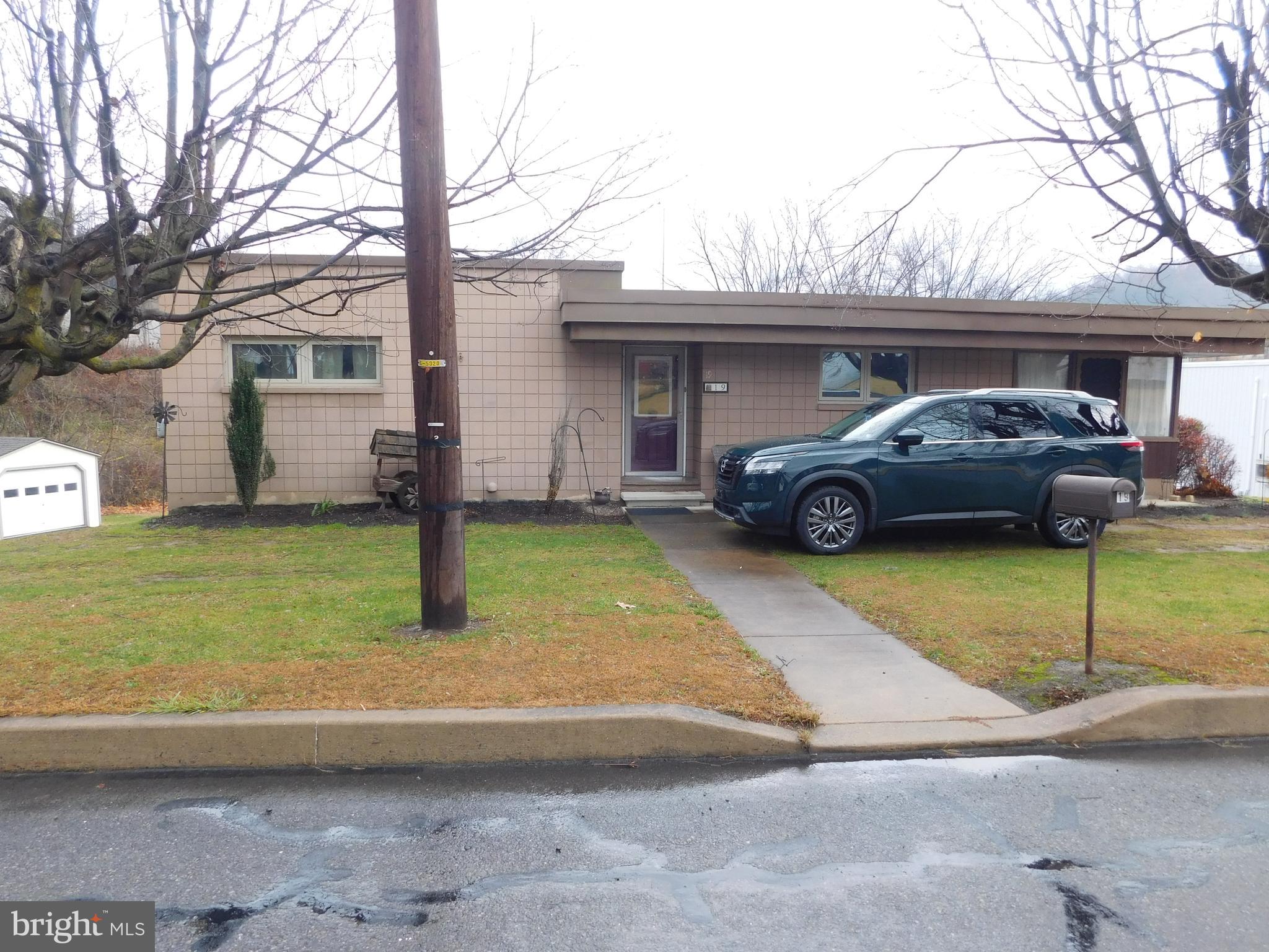 a car parked in front of a house