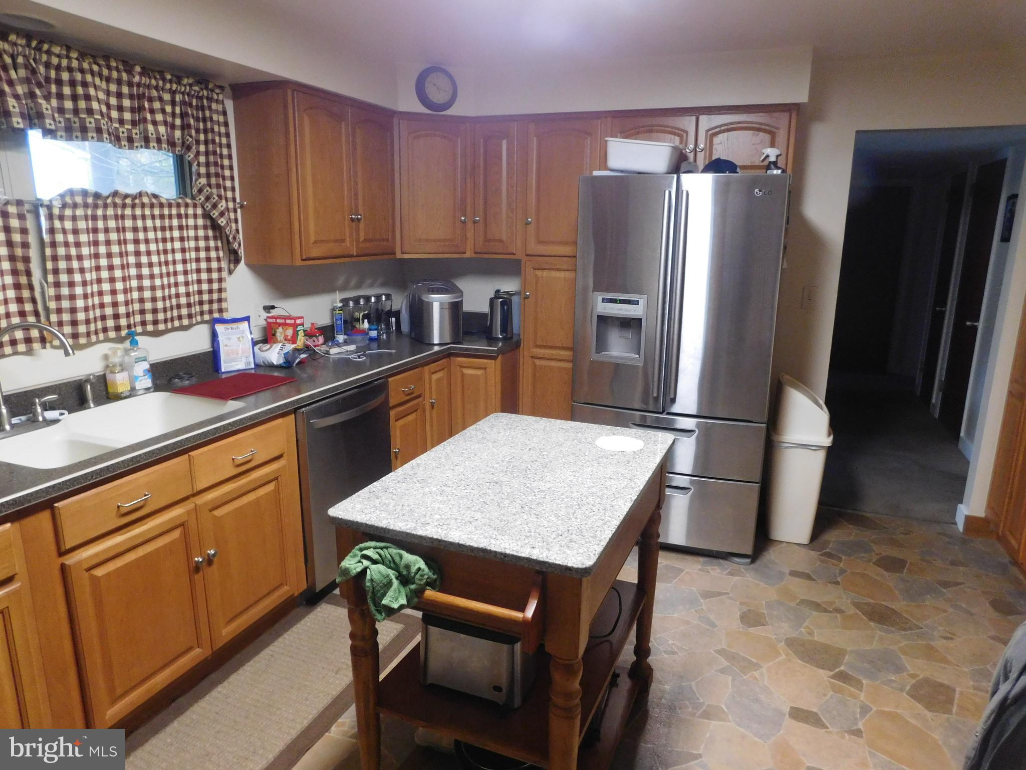 19 Ort Valley Road Lewistown, PA 17044 - Photo 4 of 7 a kitchen with stainless steel appliances granite countertop a refrigerator sink and cabinets
