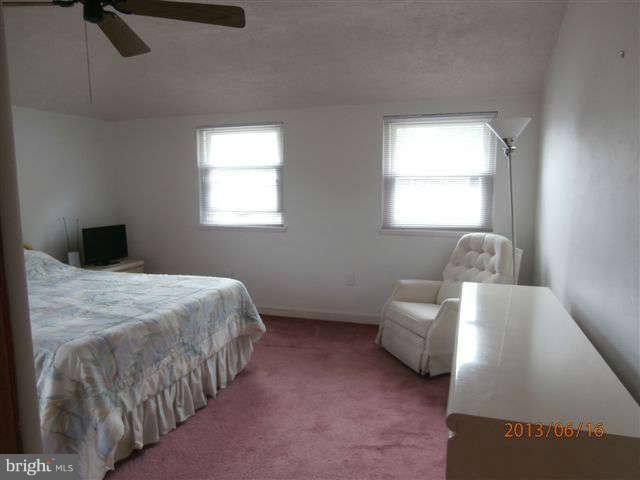 1639 Yakona Road Baltimore, MD 21286 - Photo 11 of 16 a bedroom with a bed and a window