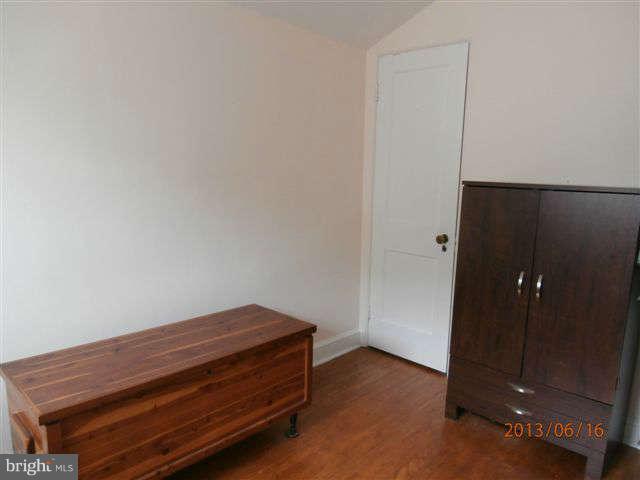 1639 Yakona Road Baltimore, MD 21286 - Photo 13 of 16 an empty room with wooden floor