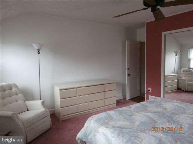 1639 Yakona Road Baltimore, MD 21286 - Photo 10 of 16 a bedroom with a bed and a couch