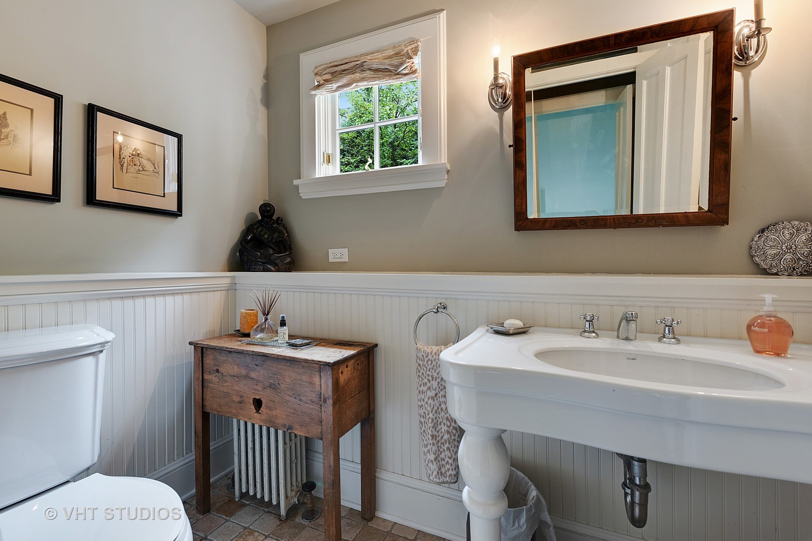 853 Valley Road Glencoe, IL 60022 - Photo 14 of 30 a bathroom with a toilet sink and mirror