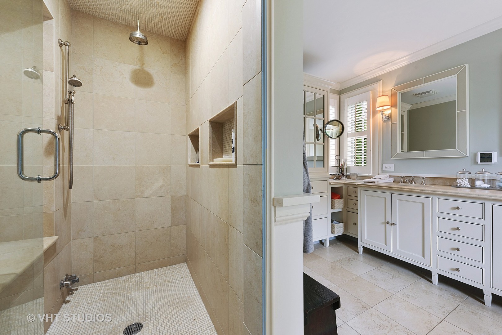 853 Valley Road Glencoe, IL 60022 - Photo 17 of 30 a bathroom with a granite countertop sink a mirror a bathtub and shower