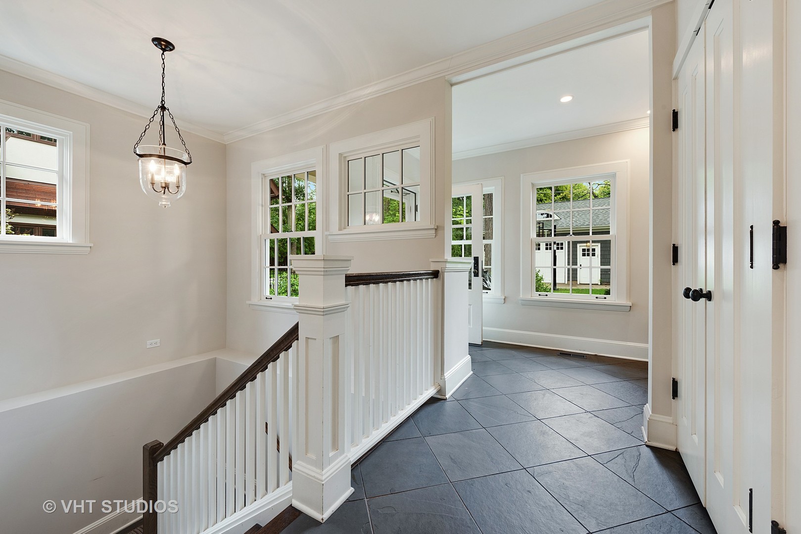 853 Valley Road Glencoe, IL 60022 - Photo 24 of 30 a view of a hallway with windows