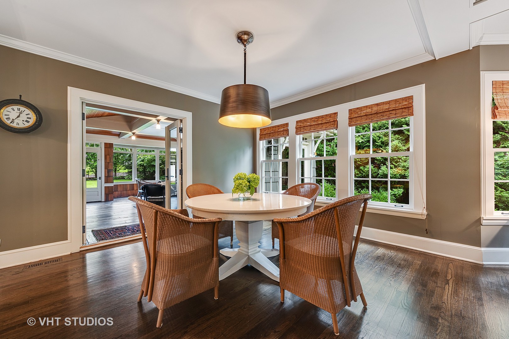 853 Valley Road Glencoe, IL 60022 - Photo 8 of 30 a dining room with furniture a chandelier and wooden floor