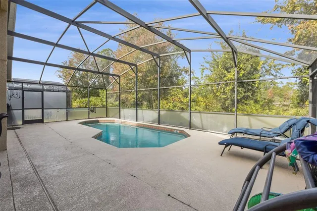 an aerial view of a house with garden space and lake view