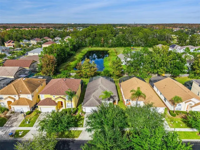 an aerial view of residential houses with outdoor space