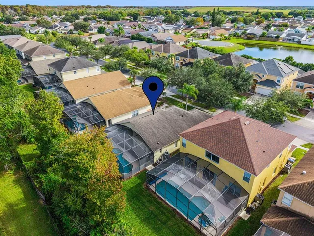 an aerial view of residential houses and outdoor space