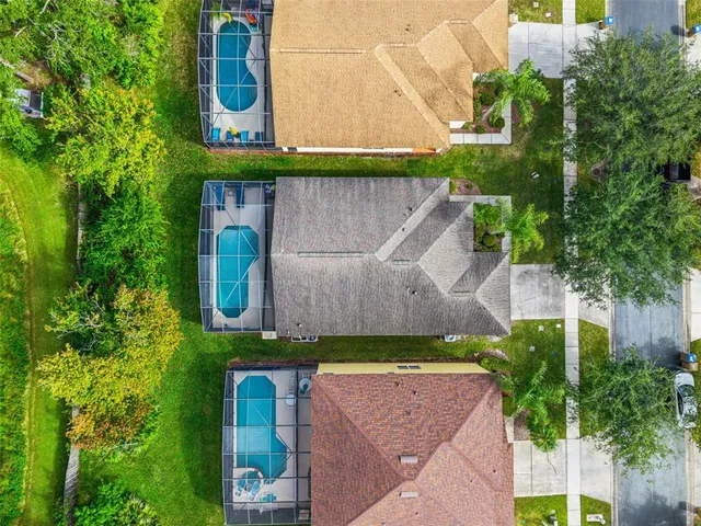 a view of a swimming pool with a table and chairs