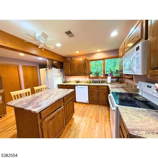 1036 Potts Mill Road Bordentown, NJ 08505 - Photo 25 of 48 a kitchen with a stove sink and cabinets