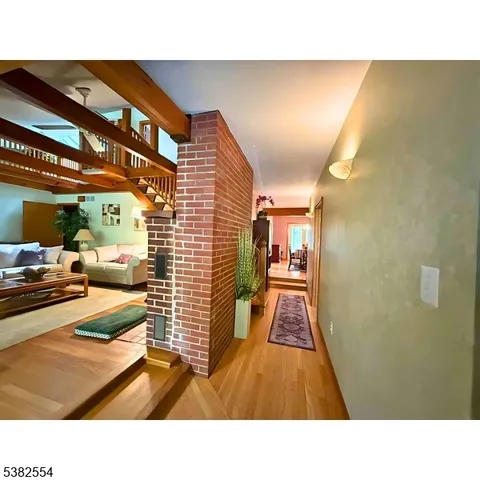 a bathroom with a sink and a view of living room