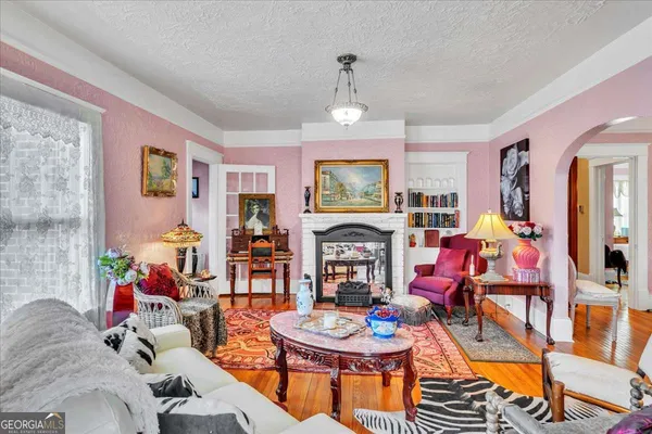 a living room with furniture a chandelier and a chandelier
