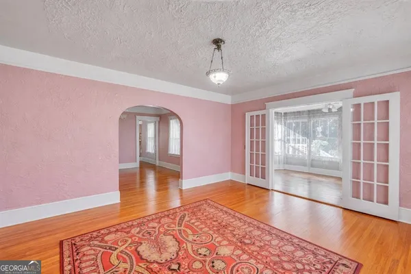 a bed room with a bed and a chandelier