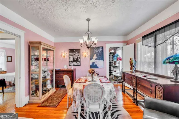 a very nice looking room with a large window and chandelier
