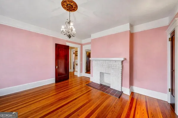 a living room filled with furniture and a large window