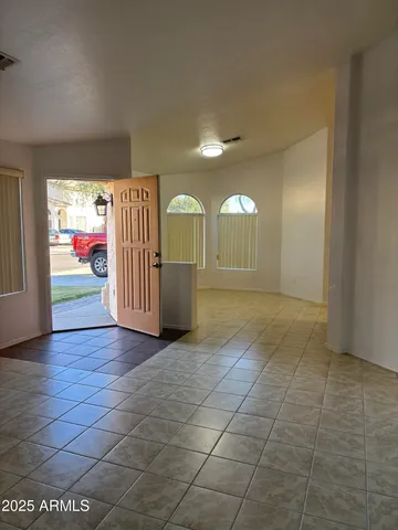 a view of an empty room with a window