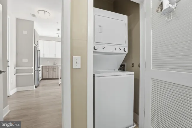 a view of bathroom with a washer and dryer
