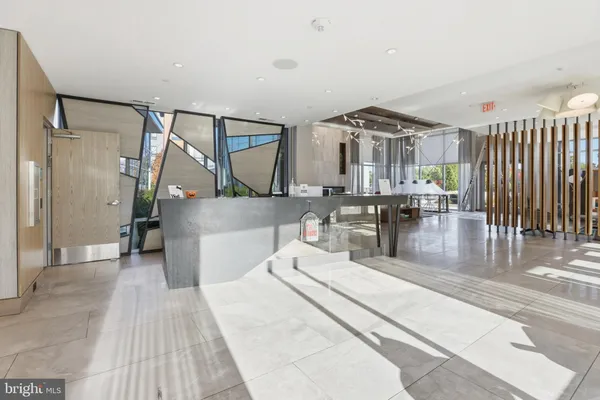 a living room with lots of table and chairs
