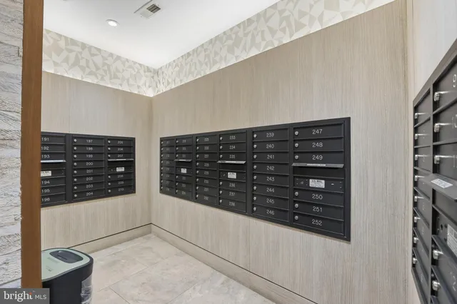 a view of walk in closet with clothes