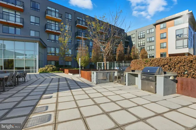 a view of a building with sitting area