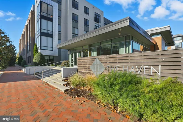 a view of a house with a small yard