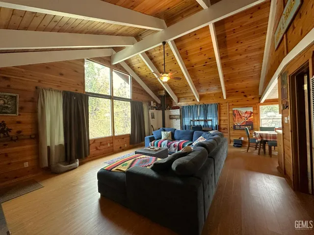 a living room with furniture a wooden floor and a window