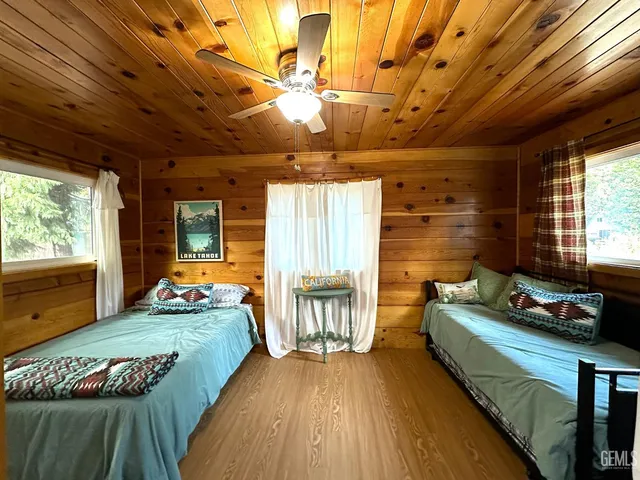 a bedroom with furniture and a window
