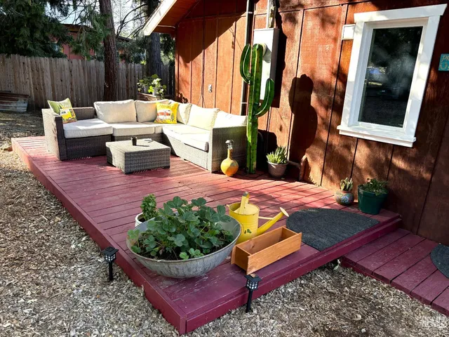 a view of a backyard with sitting area