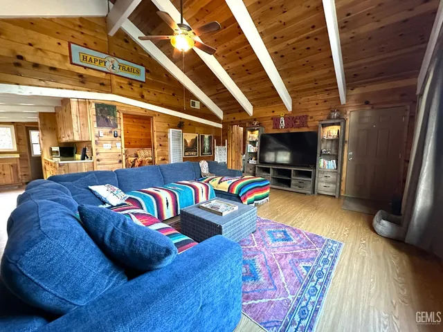 a view of a living room with furniture and a flat screen tv