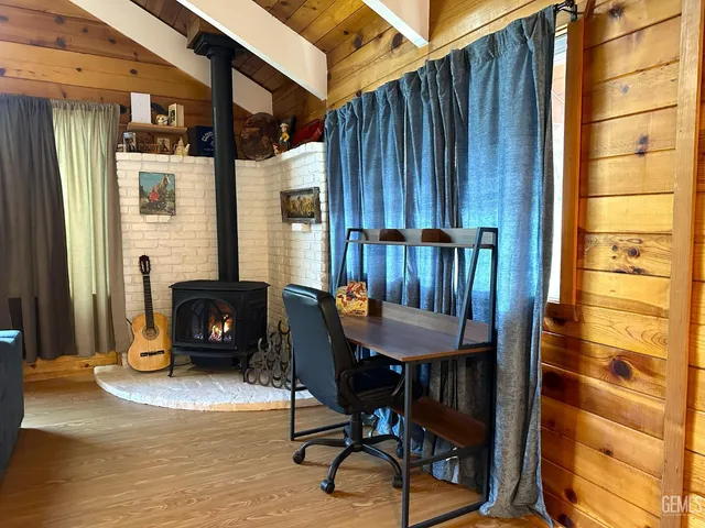 a view of a balcony with furniture and a fireplace