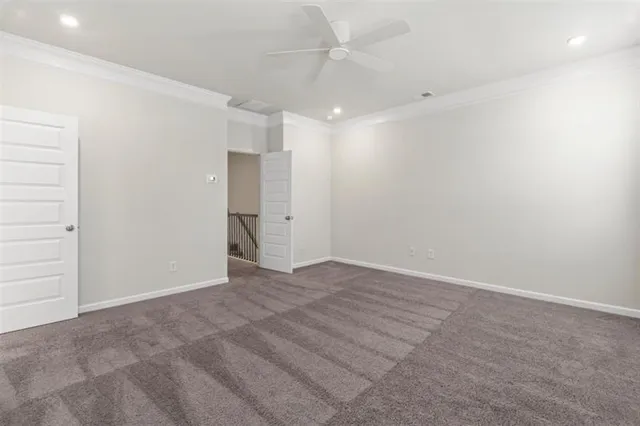 an empty room with an entryway and shower