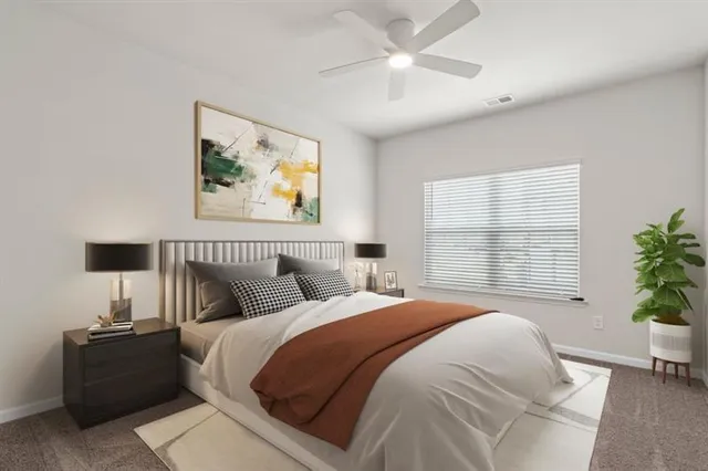 a bedroom with bed and a window