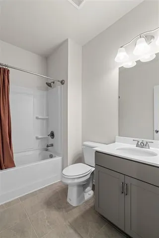 a bathroom with a sink a toilet and a bathtub