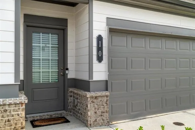 a front view of a house with a large window