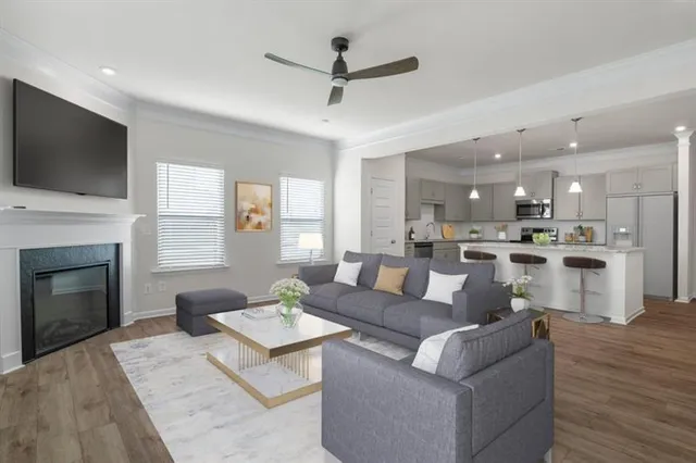 a living room with furniture fireplace and a flat screen tv