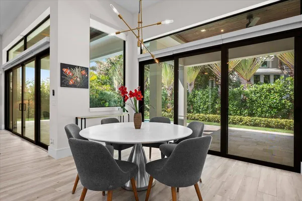 a view of a dining room with furniture and wooden floor