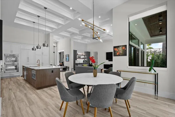 a living room with furniture fireplace and a large window