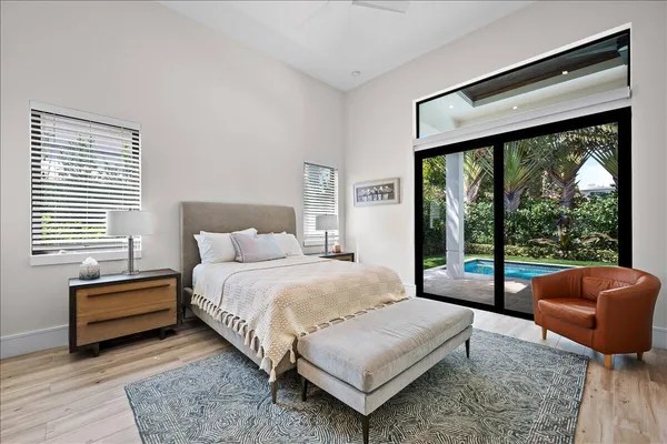 a bedroom with bed and window