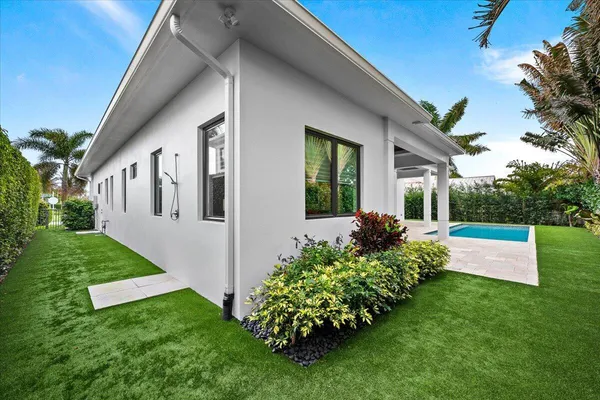 a view of swimming pool with a yard